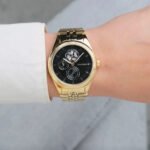 1782717-tommy-hilfiger-watch-women-skeleton-black-dial-metal-stainless-steel-gold-strap-quartz-analog-monica-990×990-1.jpg